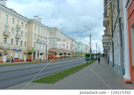 City street. Street of the Belarusian city of Gomel. City life. Urban panorama City street. Street of the Belarusian city of Gomel. City life. Urban panorama 129225302