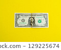 Dollar on a yellow background, background with copy space. 129225674
