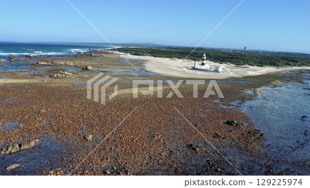 Solitary Beacon Guarding Wind-Swept Coastal Sands 129225974