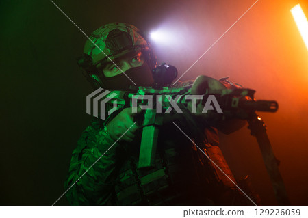 Tactical Soldier in Action Helmet On Off Dramatic Lights Smoke 129226059