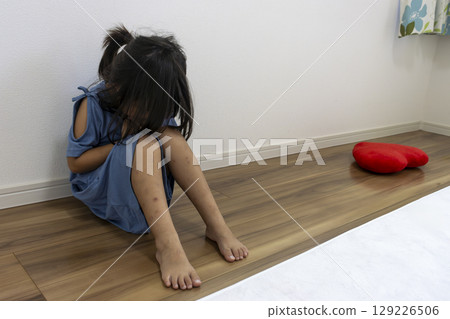 A depressed girl sitting in her room (Japanese, 5 years old) A depressed girl sitting in her room (Japanese, 5 years old) 129226506
