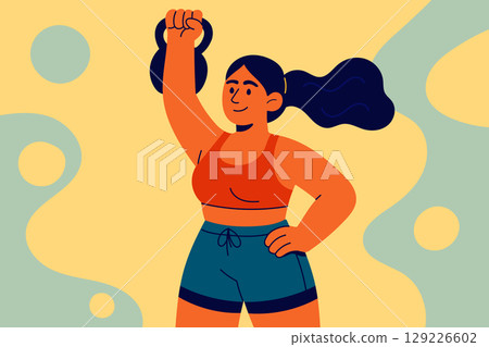 Strong athletic woman lifting kettlebell during gym workout 129226602