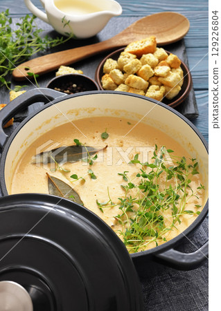 creamy salmon soup with herb in a pot creamy salmon soup with herb in a pot 129226804