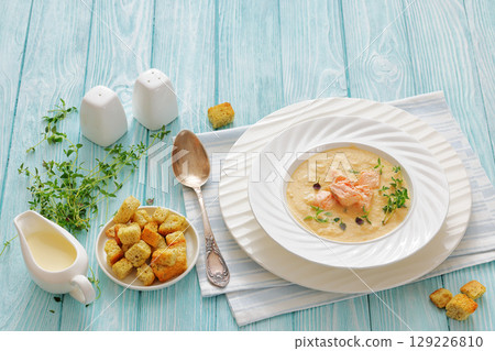 creamy salmon soup with herb in a bowl creamy salmon soup with herb in a bowl 129226810