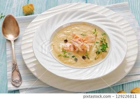 creamy salmon soup with herb in a bowl creamy salmon soup with herb in a bowl 129226811