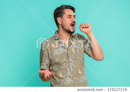 Man singing passionately into imaginary microphone expressing joy enthusiasm for musical performance 129227216