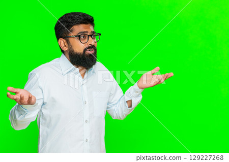 Indian man shrugging with puzzled expression making hands up gesture expressing confusion chroma key Indian man shrugging with puzzled expression making hands up gesture expressing confusion chroma key 129227268