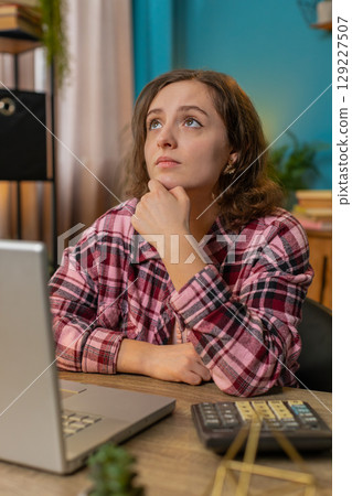 Stressed sad business woman losing job having financial problems at home office workplace bankruptcy 129227507