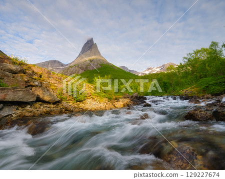 Mount Stetinden, Norway. A turbulent river. A place for rock climbing and mountaineering. 129227674