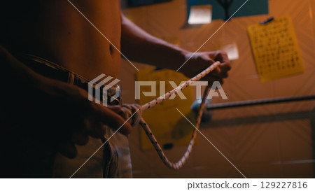 Man Hands Preparing The Knot On The Rope For Suicide 129227816