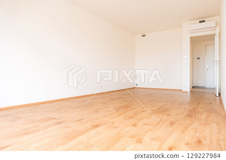 Modern empty apartment interior with wooden flooring and white walls 129227984