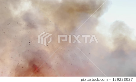 Raging flames sweeping dry land, intense inferno developing fast, escalating wildfire concern, smoke trails covering scenery, environmental devastation captured, survival of wildlife at stake, fire 129228027