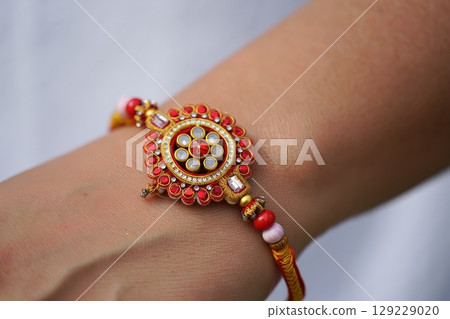 Woman wearing beautiful Rakhi on Raksha Bandhan festival Woman wearing beautiful Rakhi on Raksha Bandhan festival 129229020
