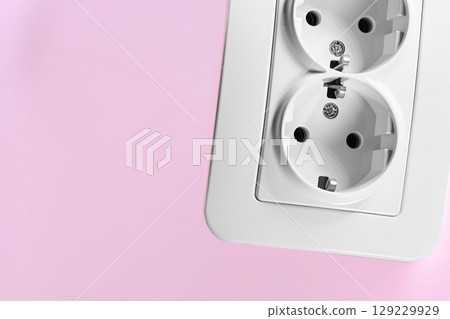 Double electrical socket for connecting devices on pink 129229929