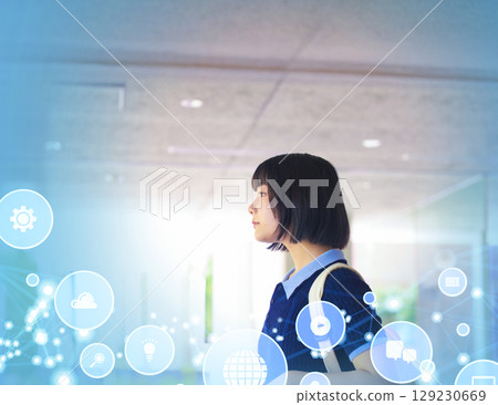 Profile of a woman walking through a future school Profile of a woman walking through a future school 129230669