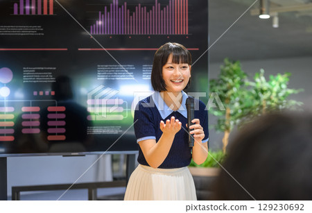 A female student speaking to the audience A female student speaking to the audience 129230692