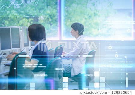 Female student concentrating on PC operation in the ICT room Female student concentrating on PC operation in the ICT room 129230694
