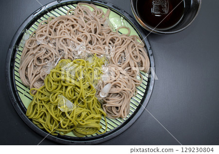 Uji tea soba and regular dried soba noodles served in a cold soba noodle dish. 129230804