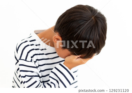 Sad elementary school boy Sad elementary school boy 129231120
