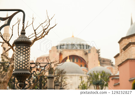 Istanbul, Turkey, July 11, 2025: A lantern hangs next to Hagia Sophia 129232827
