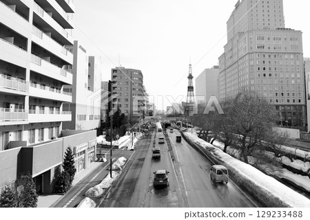 Sapporo's "Sosei River" and "TV Tower" in black and white as the snow melts 129233488