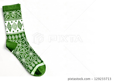 Green ornate warm sock isolated on white 129233713