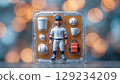 Close-up of a figurine of a baseball player with removable accessories on an isolated background 129234209