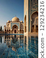 Majestic Mosque Architecture Reflected in Tranquil Waters, a Serene Oasis of Islamic Art 129234216
