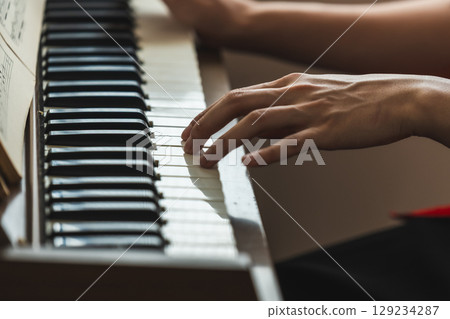Retro piano organ and man 129234287