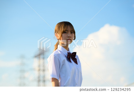 Portrait of a high school girl standing outdoors 129234295