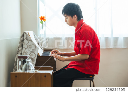 Retro piano organ and man 129234305