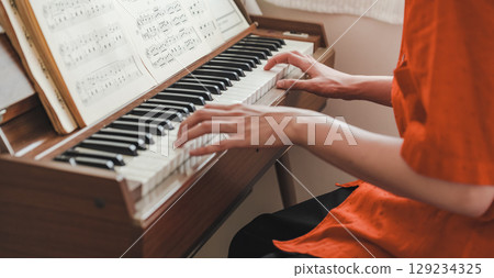 Retro piano organ and man 129234325