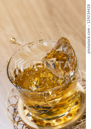 A beautiful summer drink with splashes of ice when you add it to cold barley tea A beautiful summer drink with splashes of ice when you add it to cold barley tea 129234426