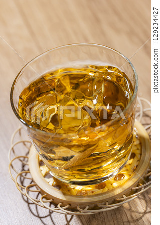 Iced barley tea served on a wooden table Iced barley tea served on a wooden table 129234427