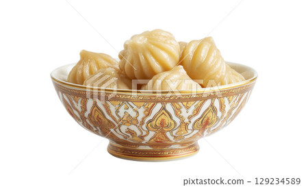 Traditional modaks arranged beautifully in bowl, created with AI, PNG 129234589