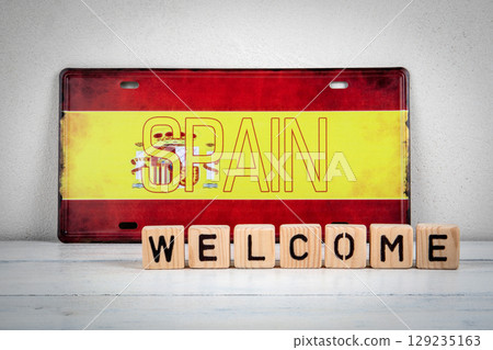 Welcome to Spain Message with Wooden Blocks and Spanish Flag Welcome to Spain Message with Wooden Blocks and Spanish Flag 129235163