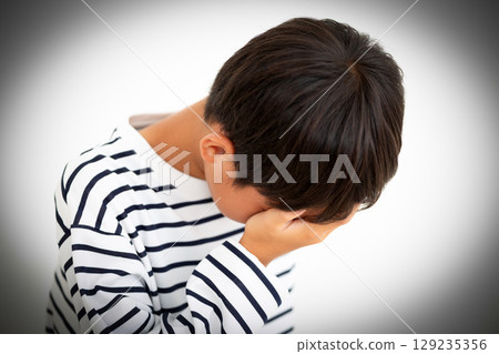 Sad elementary school boy 129235356