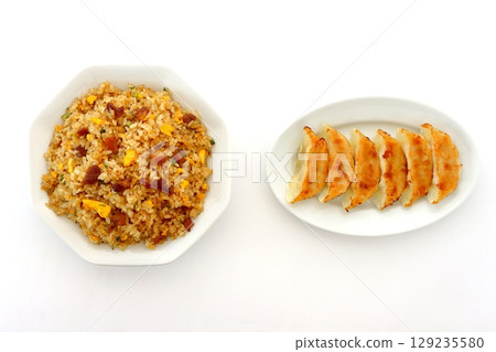 A set of fried rice and dumplings on a white background viewed from directly above 129235580