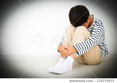 A depressed elementary school boy who stays in his room 129235635
