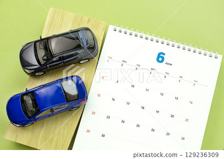 Automotive work desktop with calculator and cell phone Automotive work desktop with calculator and cell phone 129236309