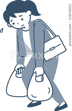 Young woman walking with heavy shopping bags 129236825