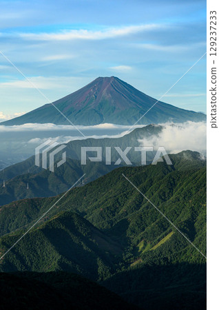Summer scenery: A spectacular view of Mt. Fuji and the mountain ranges from Mt. Karagaharazuri Summer scenery: A spectacular view of Mt. Fuji and the mountain ranges from Mt. Karagaharazuri 129237233