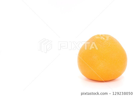 Whole grapefruit on a light background 129238050