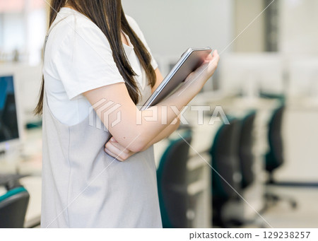 A woman with a laptop A woman with a laptop 129238257