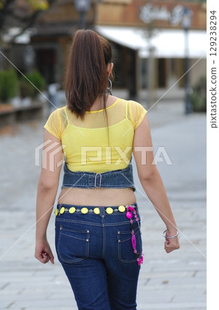 Rear view of white female model Rear view of white female model 129238294