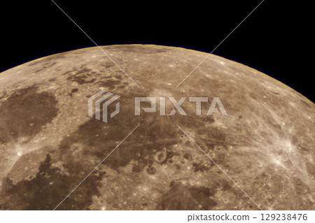 Close up telescope image of the moon's cratered surface with mare Close up telescope image of the moon's cratered surface with mare 129238476