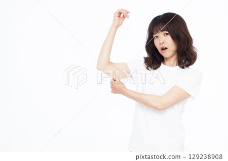 A woman who cares about the fat in her upper arm A woman who cares about the fat in her upper arm 129238908