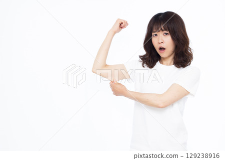 A woman who cares about the fat in her upper arm A woman who cares about the fat in her upper arm 129238916