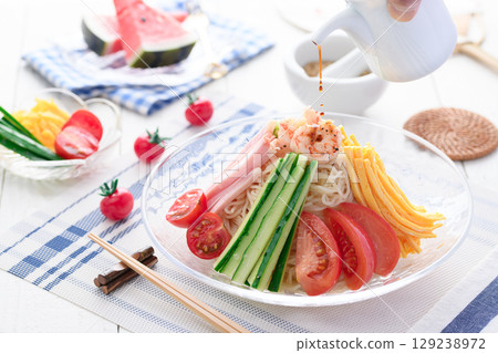 Cool and refreshing cold Chinese noodles served in summer, refreshing lunch, dining table image Cool and refreshing cold Chinese noodles served in summer, refreshing lunch, dining table image 129238972