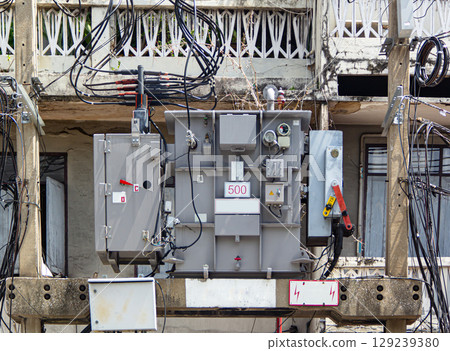 High voltage transformers on utility poles. High voltage transformers on utility poles. 129239380